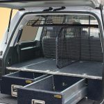 A 200 Series LandCruiser fitted with an RV Top Shelf/Dividing Barrier combo on our air bag compliant Half Cargo Barrier.